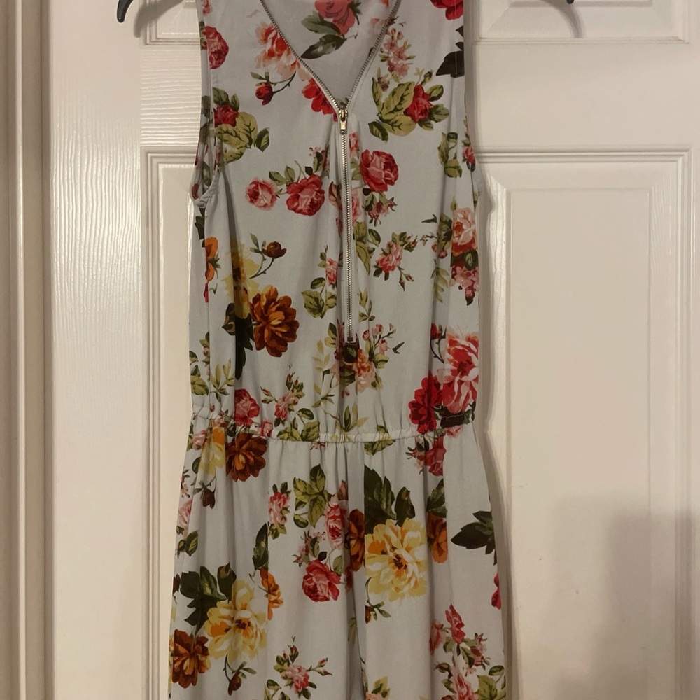 Floral Sleeveless Romper with elastic waist and‎ zipper detail neckline